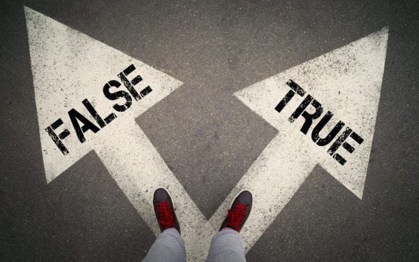 TRUE versus FALSE written on the white arrows, dilemmas concept.