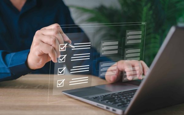 Electronic smart checklist and document on virtual screens concept, business people check electronic documents on digital documents, paperless offices,working on borderless communication technology