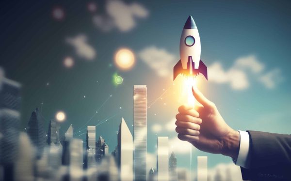 a hand holding a rocket